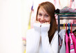 Young woman inside a store buying clothes