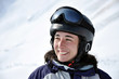 Portrait of a smiling skier woman with helmet