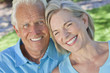 Happy Senior Couple Smiling Outside in Sunshine