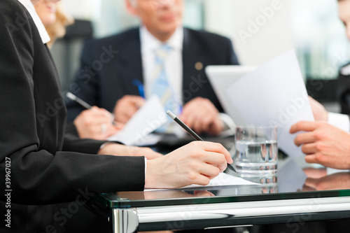 Photo: Business meeting with work on contract Business meeting with work on contract
