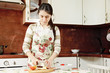 Brunette cutting apple