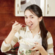 Woman tasting salad