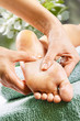 Foot massage in the spa salon in the garden