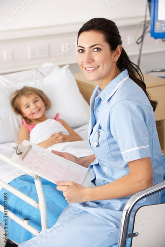 Photo: Nurse with child patient in UK Accident and Emergency Nurse with child patient in UK Accident and Emergency