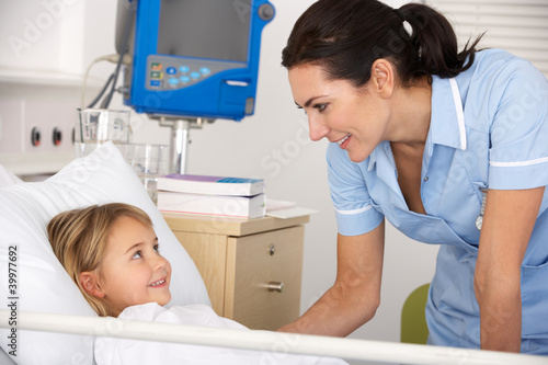 Photo: Nurse with child patient in UK Accident and Emergency Nurse with child patient in UK Accident and Emergency