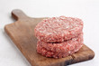 Raw burgers stacked