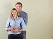Studio Shot Of Relaxed Middle Aged Couple