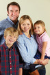 Studio Shot Of Relaxed Family