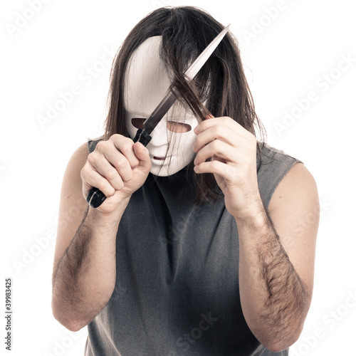 Photo: Scary man cutting his hair Scary man cutting his hair