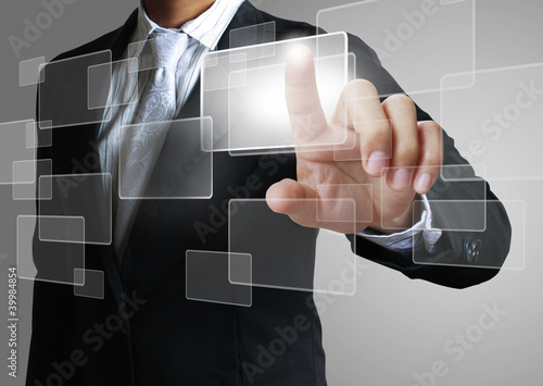 Photo: hand pushing on a touch screen interface hand pushing on a touch screen interface