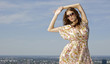 beautiful girl in sunglasses on background blue sky