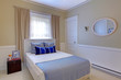 Blue and white bedroom with elegant design.