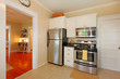 Small simple kitchen with white cabinets.