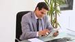 Video: Businessman working with a tablet computer Businessman working with a tablet computer