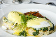 Eggs Florentine Benedict on White Plate Eggs Florentine Benedict on White Plate