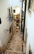 Narrow street in Alfama neighborhood, Lisbon city, Portugal