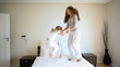 Video: Mother and daughter jumping on a bed Mother and daughter jumping on a bed