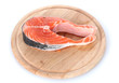 Red fish with on wooden cutting board isolated on white.