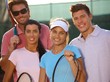 Portrait of smiling tennis team Portrait of smiling tennis team