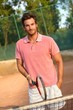 Handsome male tennis player smiling Handsome male tennis player smiling