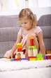 Photo: Little girl playing at home Little girl playing at home