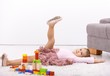 Photo: Little ballerina posing on floor Little ballerina posing on floor