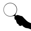 Magnifying glass in hand