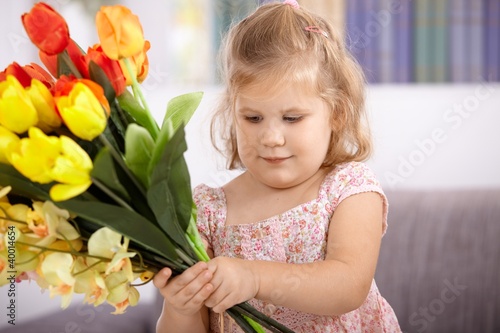 Photo: Little girl with tulips Little girl with tulips