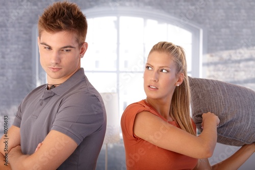 Photo: Upset girlfriend hit boy with pillow Upset girlfriend hit boy with pillow