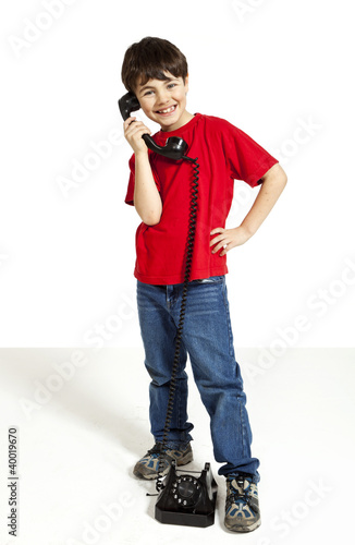 Photo: portrait of little boy on the phone portrait of little boy on the phone