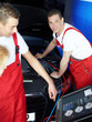 Motor mechanic working on engine bay with air handling unit