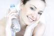 Photo: portrait of young woman with bottle portrait of young woman with bottle