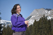 Portrait of a young woman at winter in the mountains