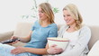 Blonde women watching TV