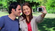 Video: Smiling couple taking a picture of themselves Smiling couple taking a picture of themselves