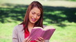 Video: Cheerful woman reading an interesting novel Cheerful woman reading an interesting novel