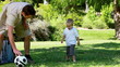 Video: Father playing with his son with a football Father playing with his son with a football