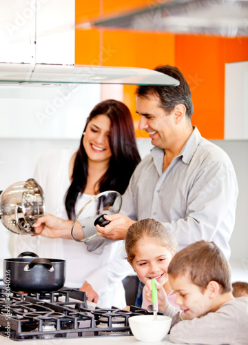Photo: Family cooking dinner Family cooking dinner