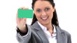 Brunette woman holding a business card