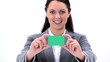 Happy brunette holding a business card