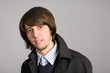 young man with a gray wall