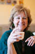 Mature woman drinking tea