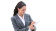 Brunette businesswoman writing on a clipboard