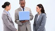 Three business people using a laptop