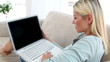 Blonde woman using a laptop