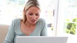 Blonde woman using video chat