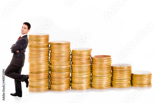 Photo: Young business man and coins, isolated on white Young business man and coins, isolated on white