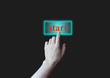 hand pressing start button