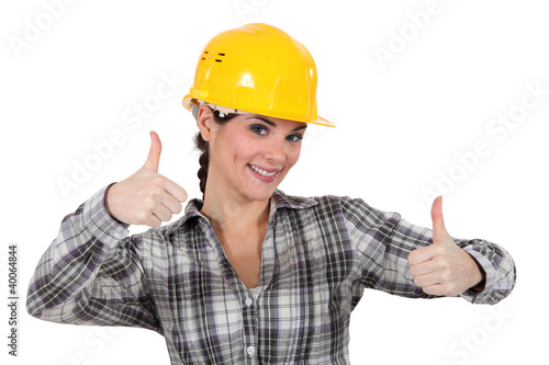 Photo: Smiling tradeswoman giving two thumb's up Smiling tradeswoman giving two thumb's up
