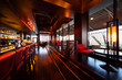 Row of tables, seats and bar counter with chairs in restaurant
